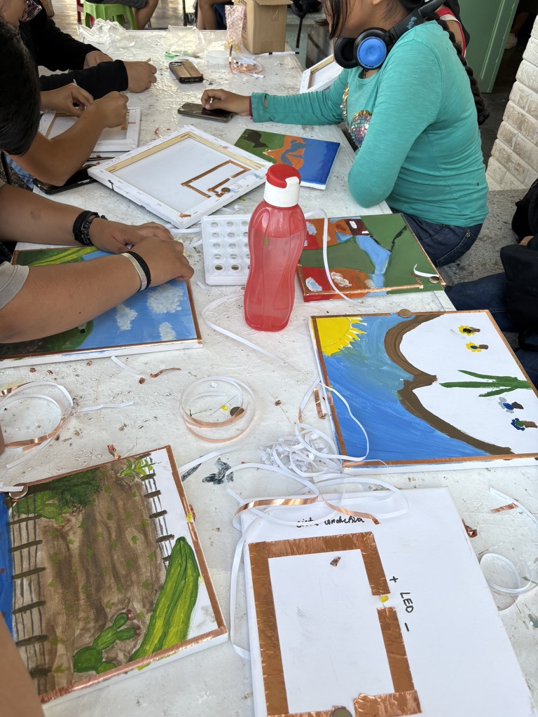 The group working on the painted circuit together